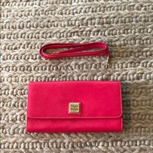 Pink Dooney & Burke clutch with detachable strap